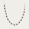 Necklace with drops of black crystals on dainty silver chain