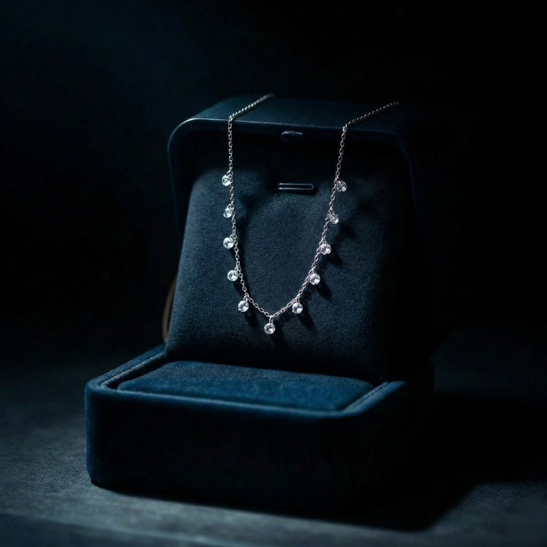 Necklace with drops of white crystals on a dainty silver chain