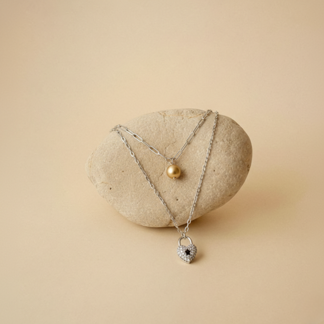 Necklace with heart shaped pendant and pearl drop