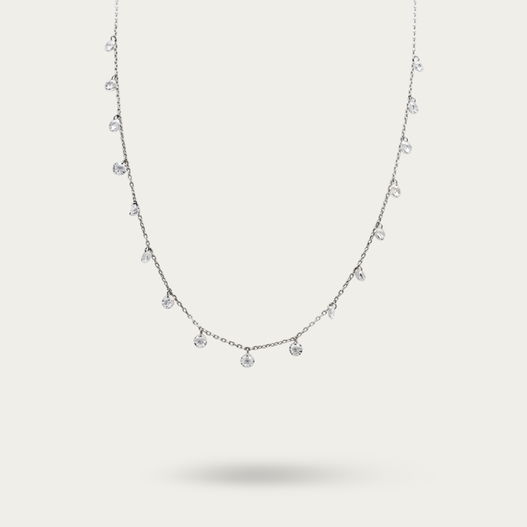 Necklace with drops of white crystals on a dainty silver chain