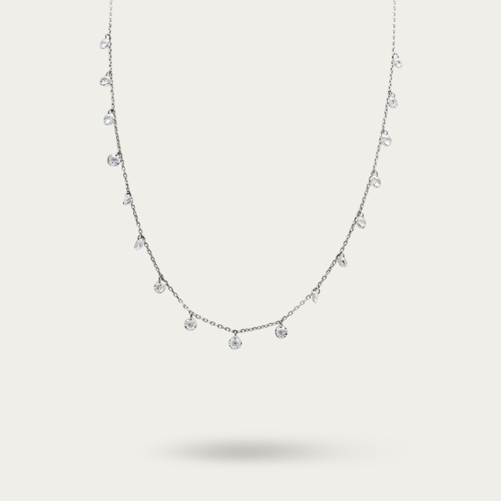 Necklace with drops of white crystals on a dainty silver chain