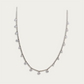 Necklace with drops of white crystals on a dainty silver chain