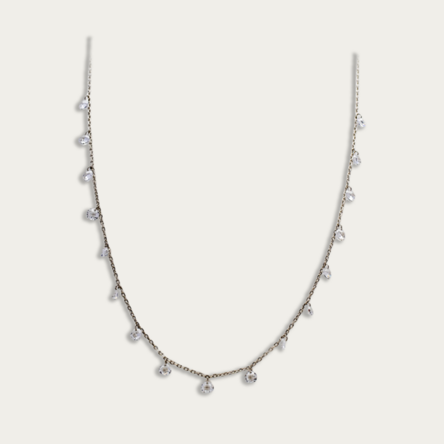 Necklace with drops of white crystals on a dainty silver chain