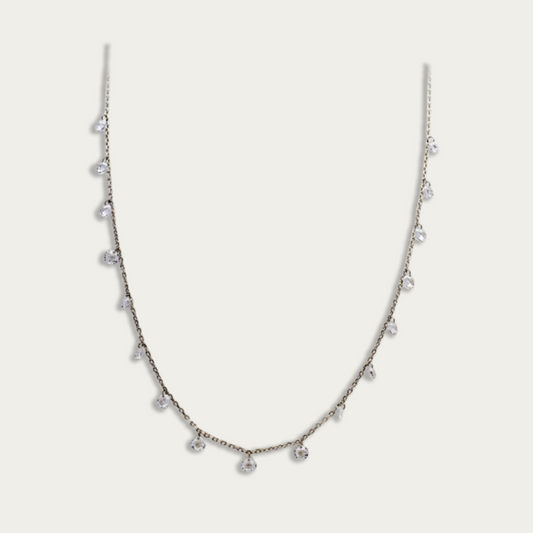 Necklace with drops of white crystals on a dainty silver chain
