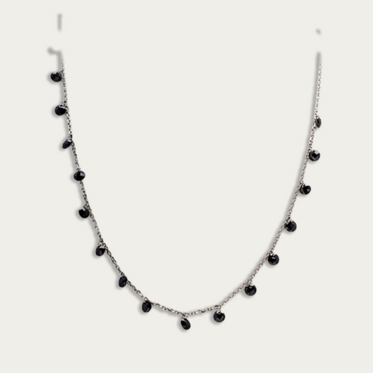 Necklace with drops of black crystals on dainty silver chain