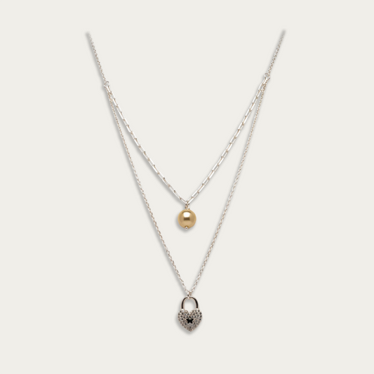 Necklace with heart shaped pendant and pearl drop