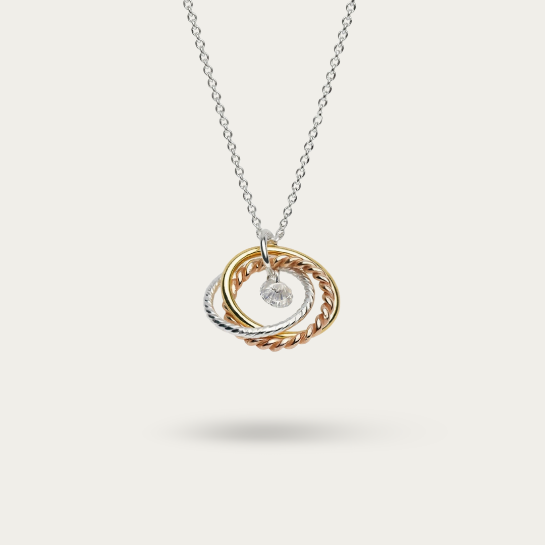 Necklace Intertwined 3 tone rings with a CZ drop