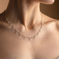 Necklace with drops of white crystals on a dainty silver chain