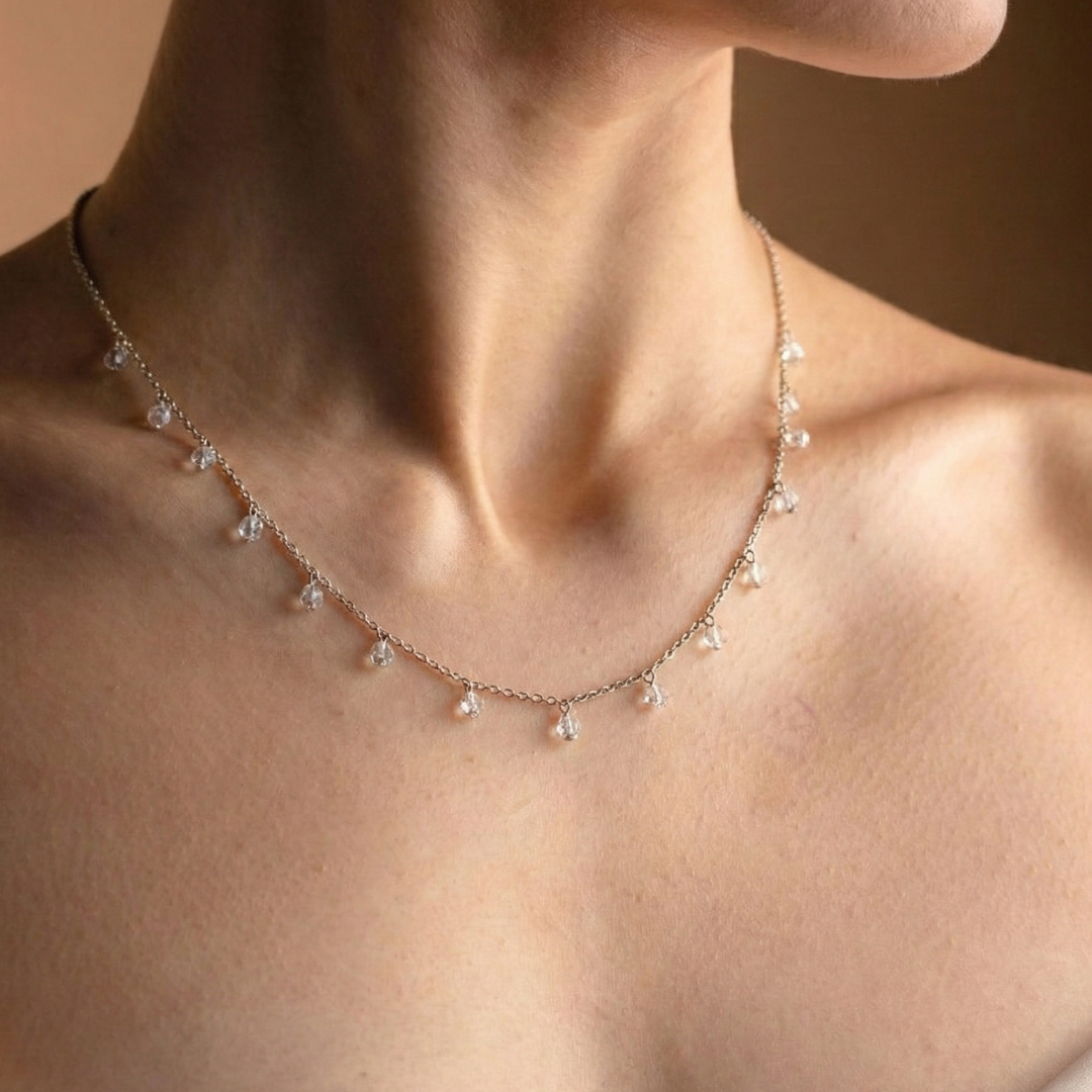 Necklace with drops of white crystals on a dainty silver chain