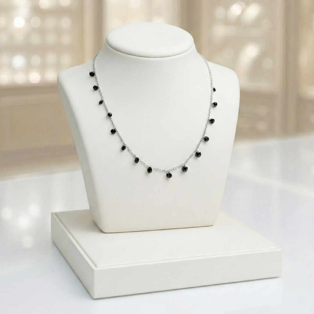 Necklace with drops of black crystals on dainty silver chain