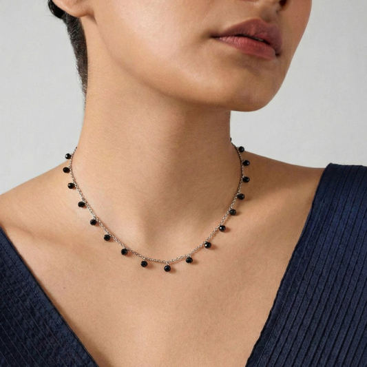 Necklace with drops of black crystals on dainty silver chain