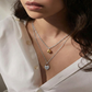 Necklace with heart shaped pendant and pearl drop